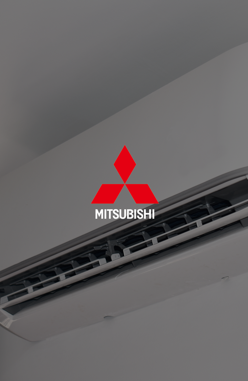 A mitsubishi air conditioner is hanging on a wall