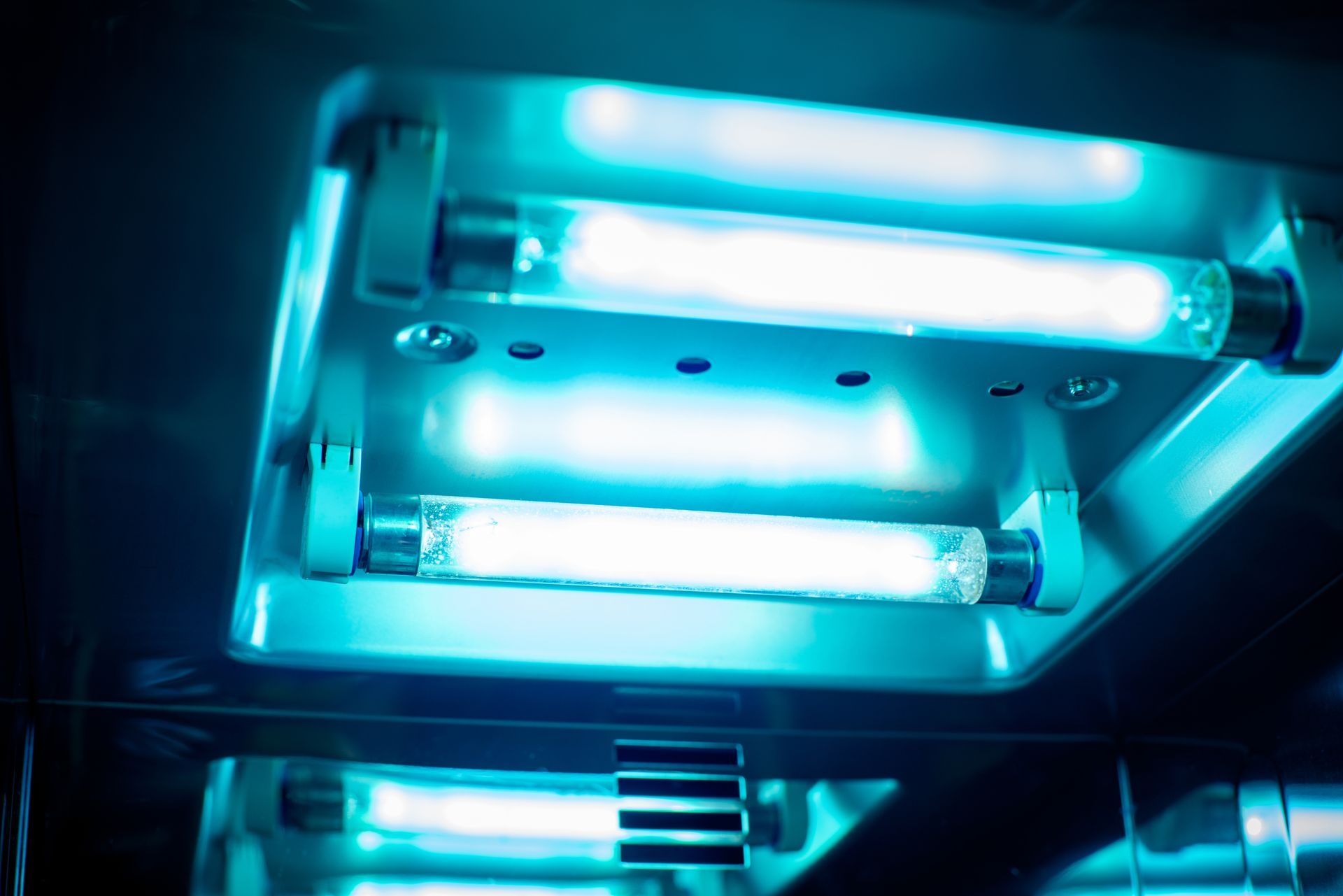 A close up of a uv light in a dark room.