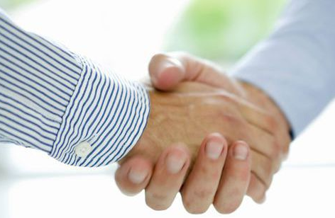 Men shaking hands after wrongful death agreement in Salt Lick, KY