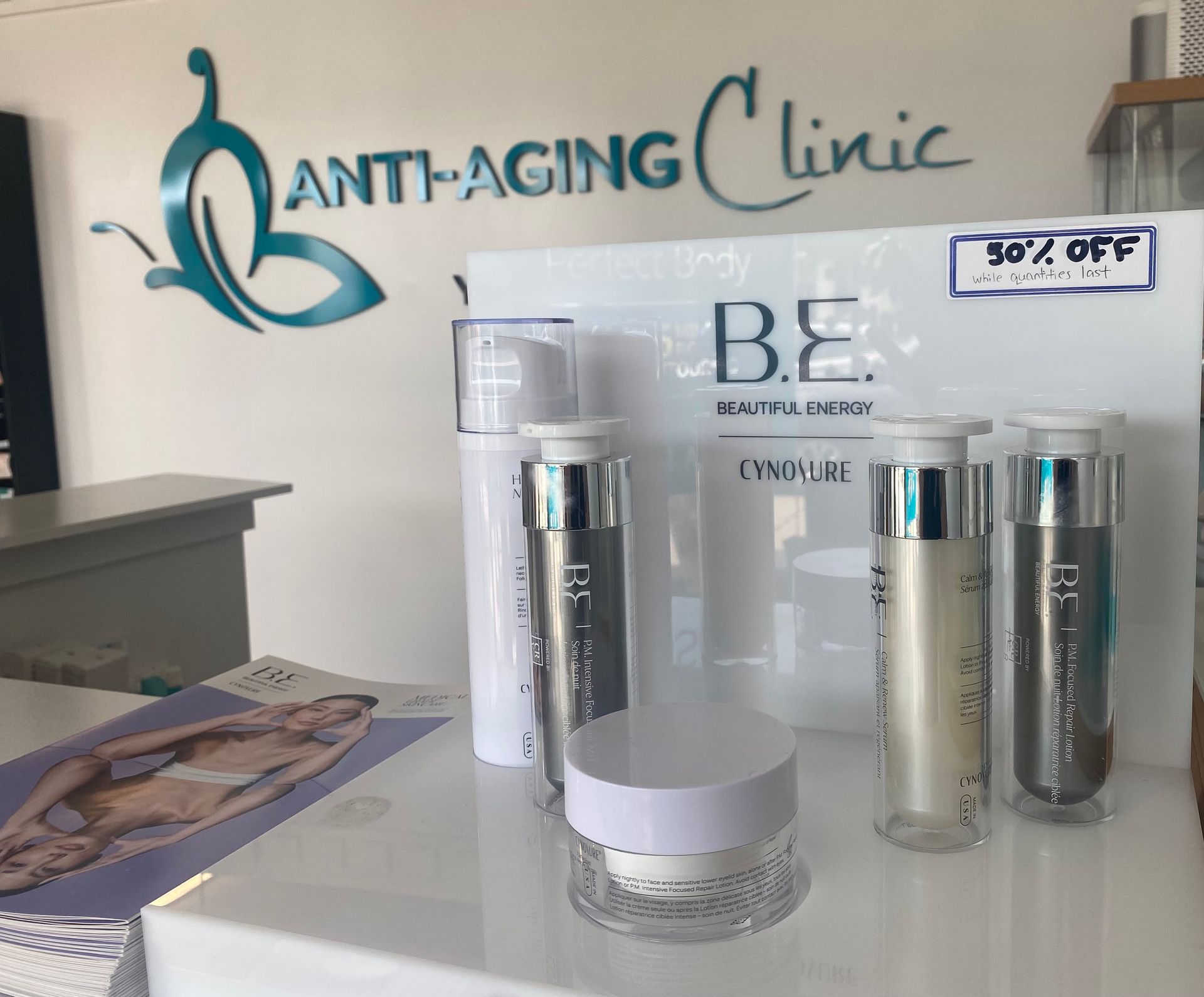 A display of anti-aging cosmetics in front of a sign that says anti-aging clinic