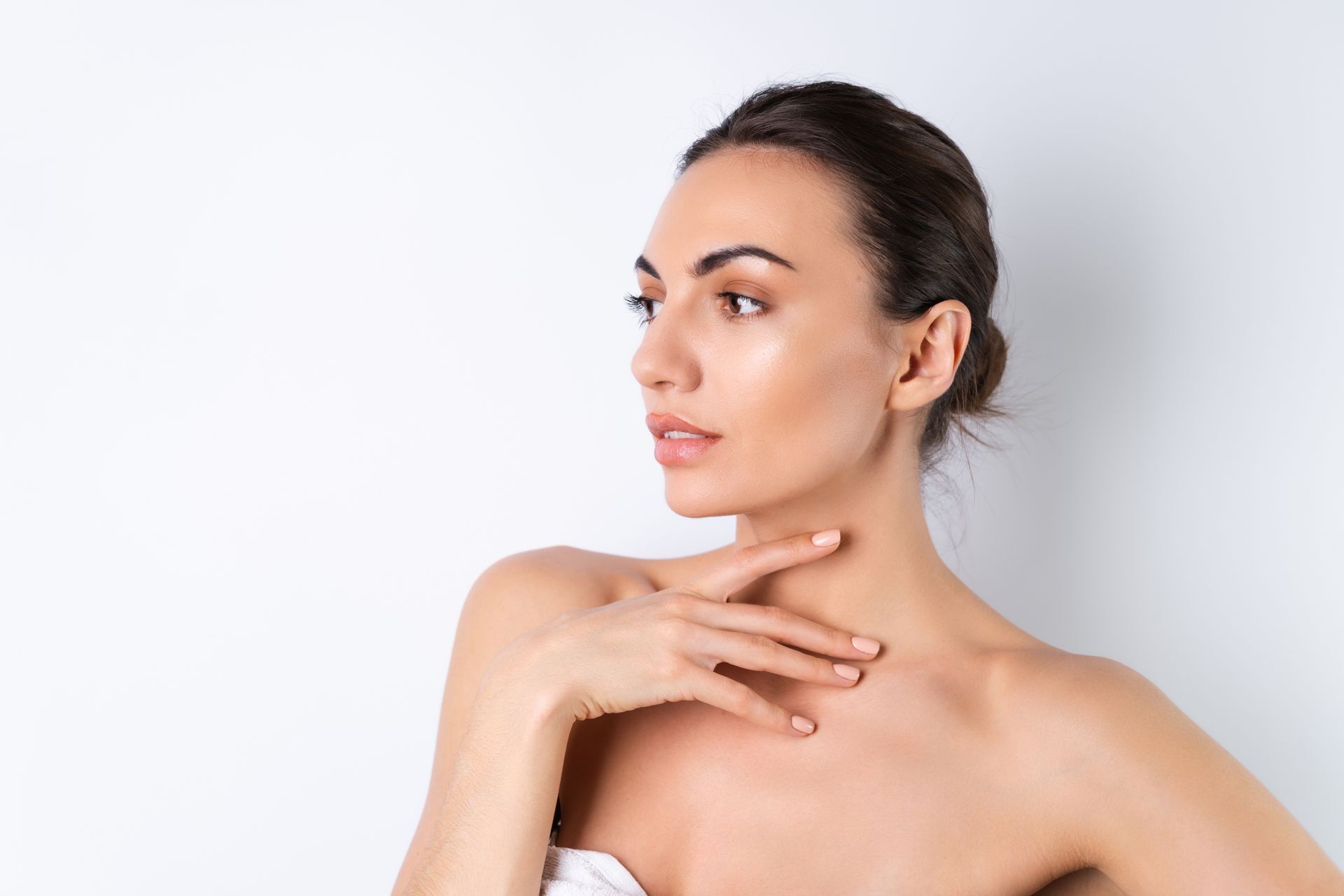 A woman touching her neck