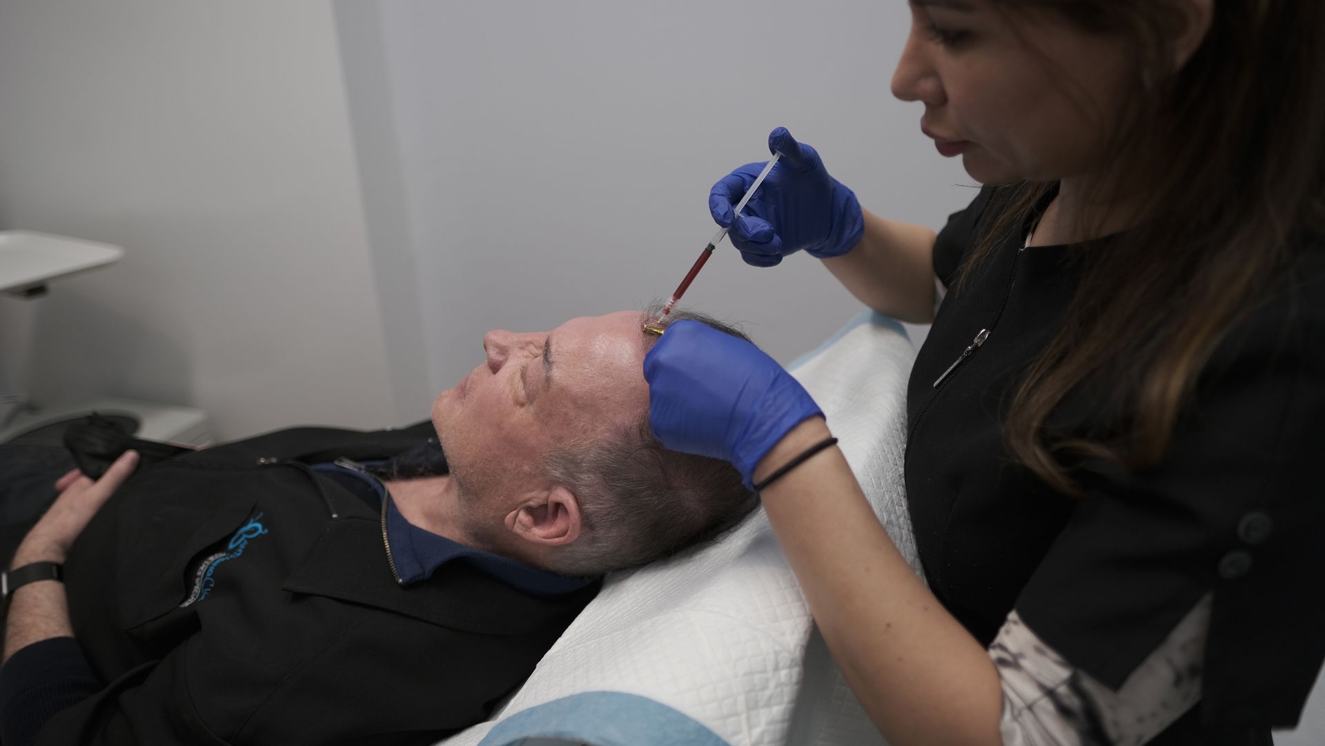 Lady getting PRP hair treatment.