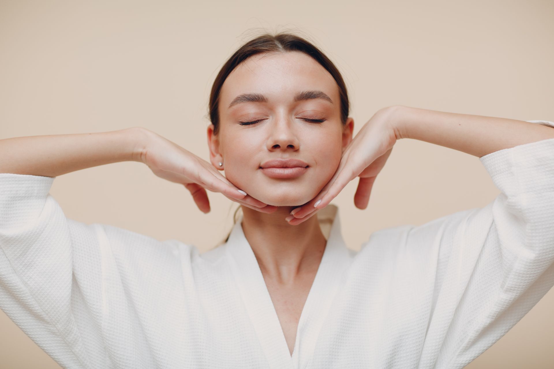 A woman is getting a laser treatment on her face.