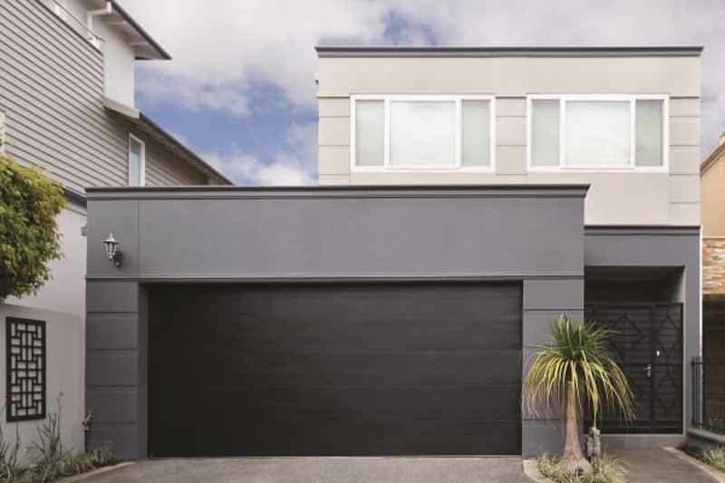 black garage door on modern home