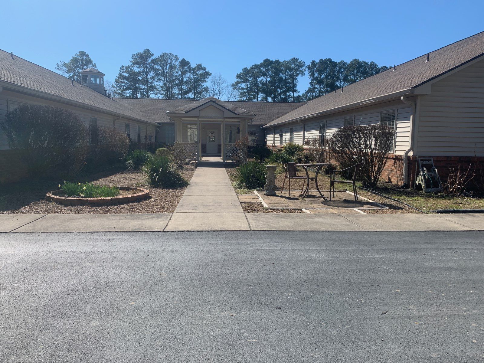 A large house with a walkway leading to it
