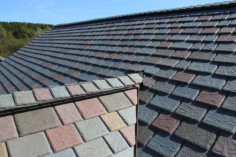 A close up of a roof with a lot of tiles on it.