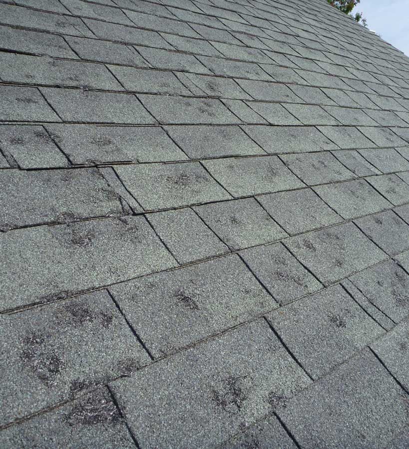 A close up of a roof with a lot of shingles on it.