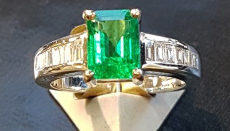 a ring with green stone