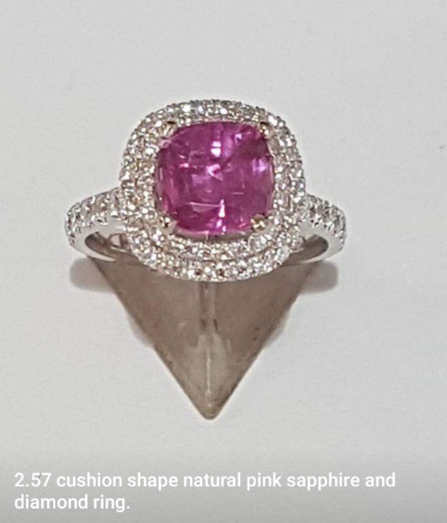 a pink sapphire encircled with diamond stones