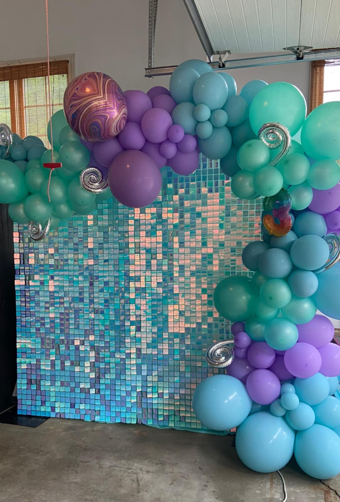 mermaid theme party shimmer wall and balloon garland