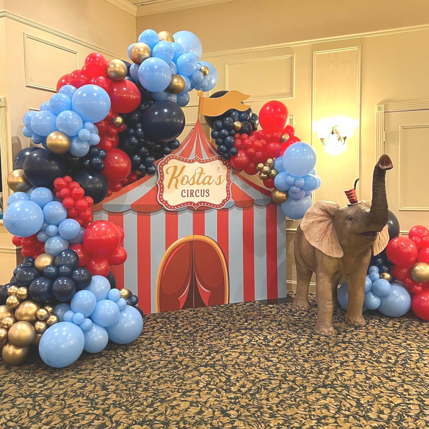 elegant circus first birthday balloon garland backdrop and blessed baptism event