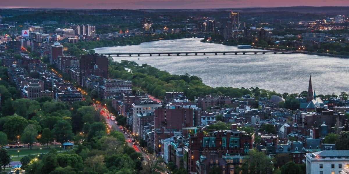 Harvard Ave night scene near Prolific Cannabis—Dispenary Boston with simple transit and parking.