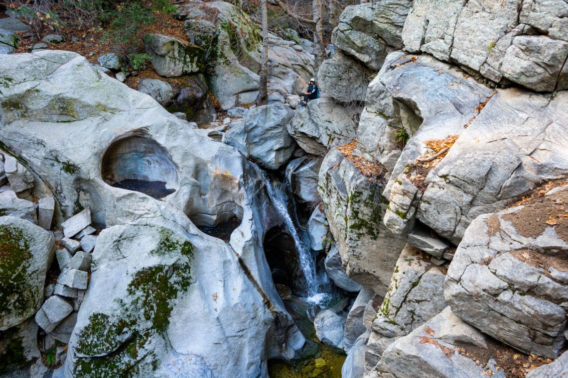 A sunset over a mountain range with a lot of fog