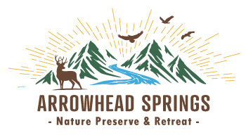 Logo: Mountains, river, deer, birds, and text