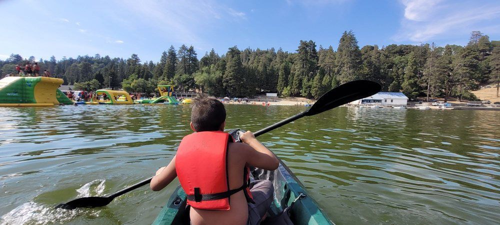 A sunset over a mountain range with a lot of fog