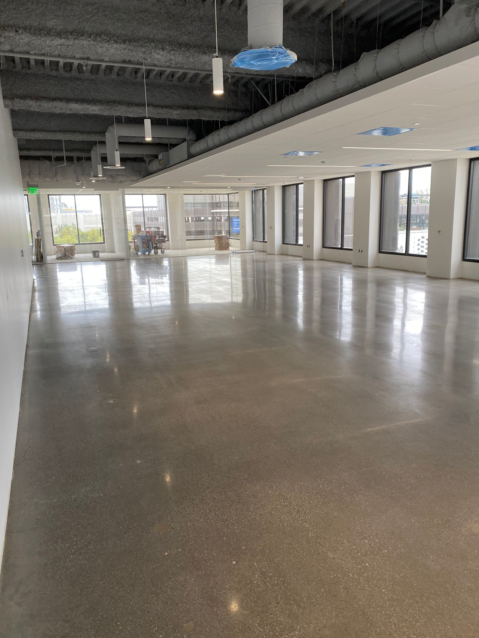 A large empty room with a lot of windows