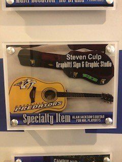 Visual — Brown and Yellow Guitar in Franklin, TN