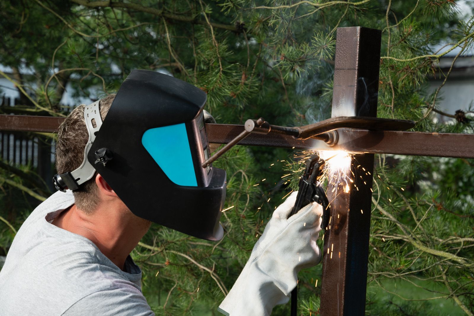 A wooden fence with a gate attached to it.