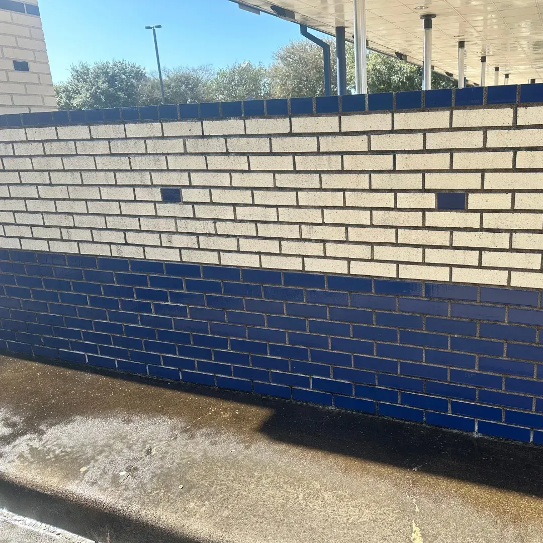 A white and blue brick wall with a blue border