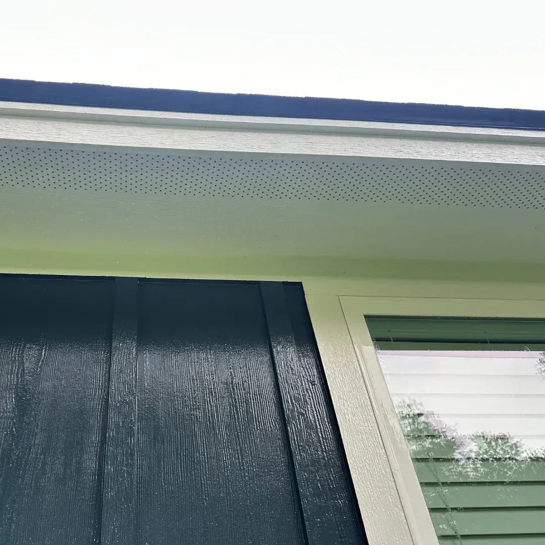 A close up of a window on the side of a house.