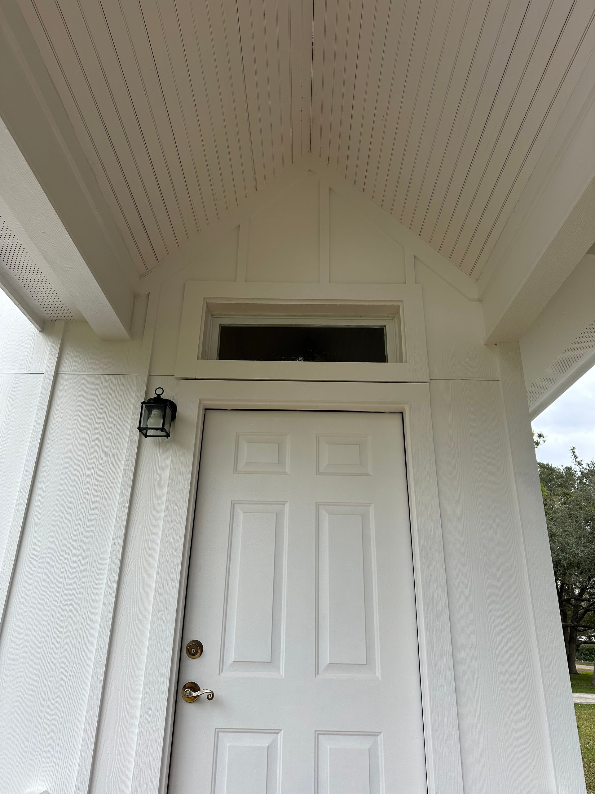 A white door with a window on top of it