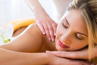 Woman getting body massage in Spa — Massage Therapy in Sarasota, FL