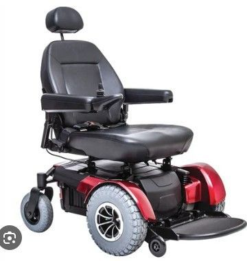  Black and red powered wheelchair with large wheels.
