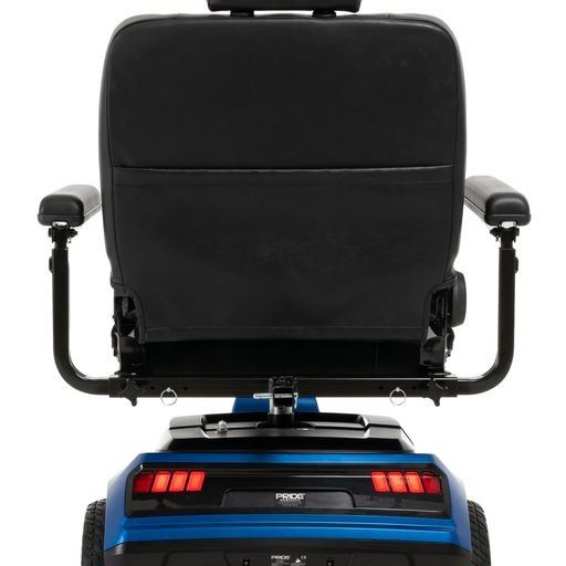 The back of a blue and black mobility scooter on a white background.