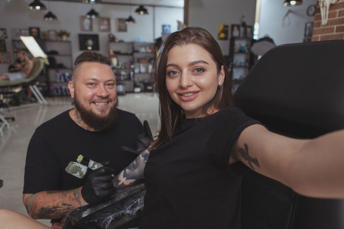 Woman Getting A Tattoo — Orlando, FL — Red Gypsy Ink