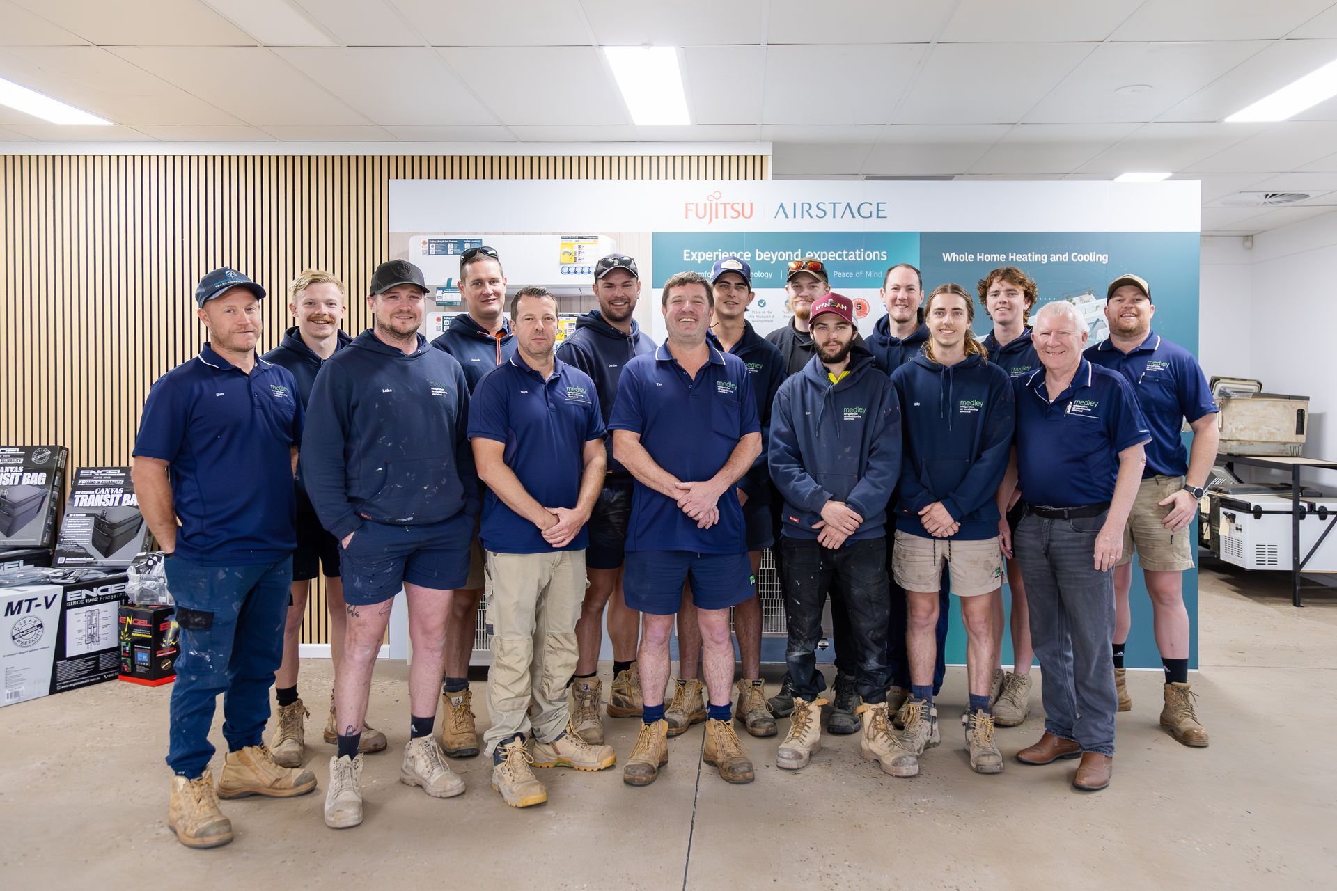 Medley team member standing in front of a white truck.