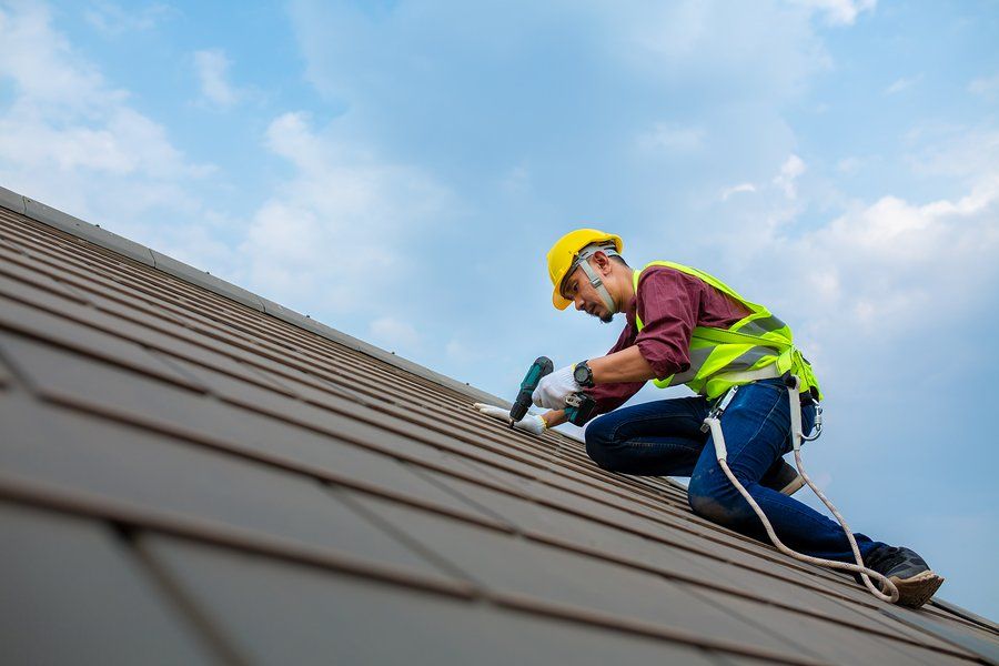 man in the roof with safety harness