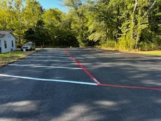 A parking lot with a red line in the middle of it