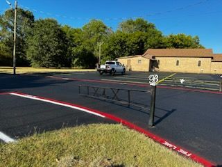 A white truck is parked in a parking lot