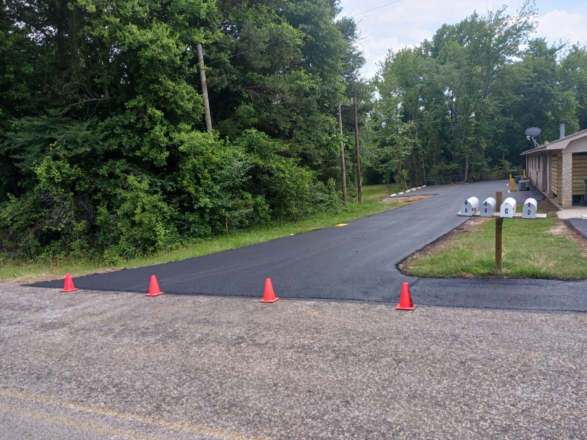 A road with a mailbox on the side of it