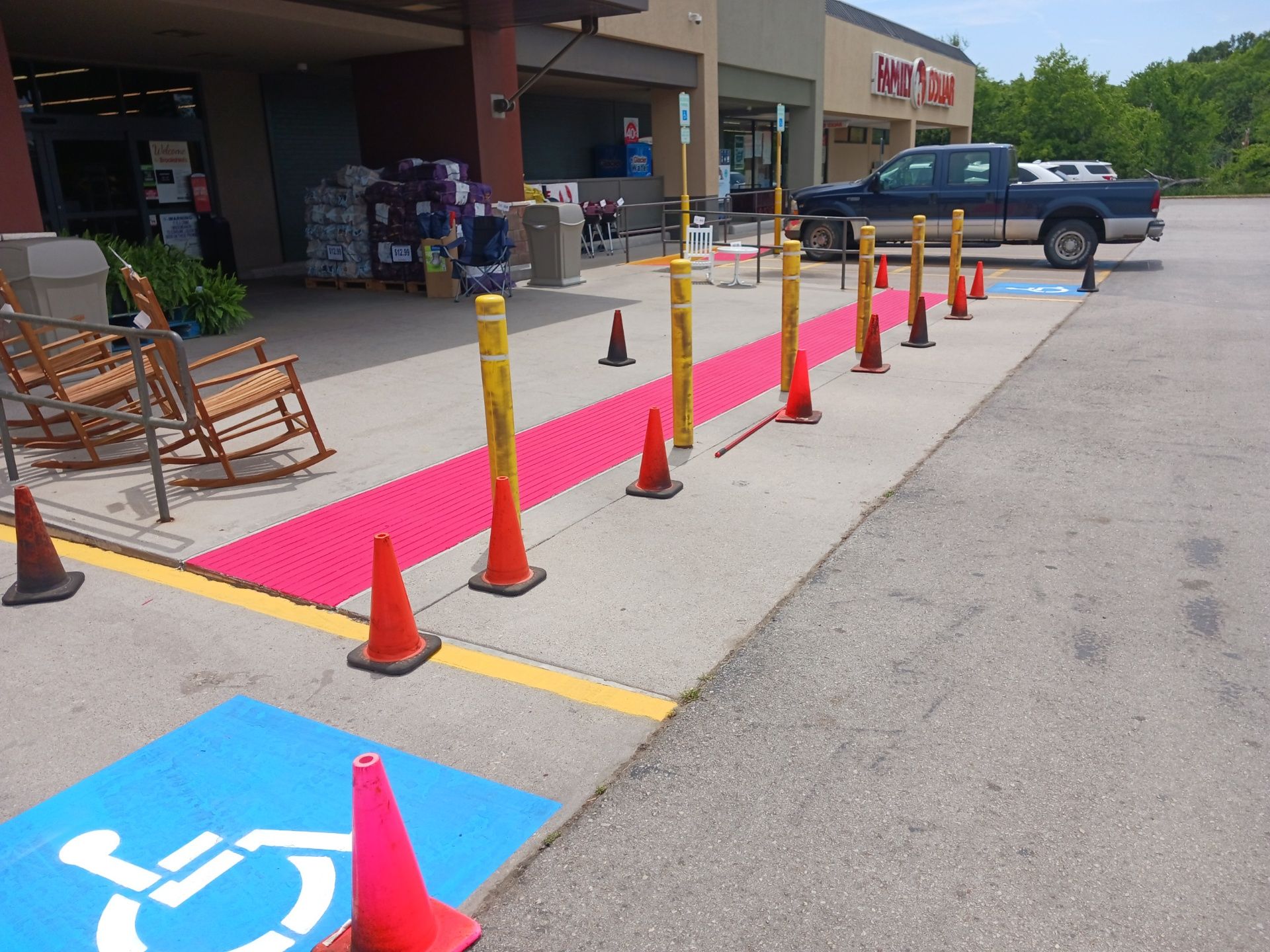 A handicapped parking spot in front of a store