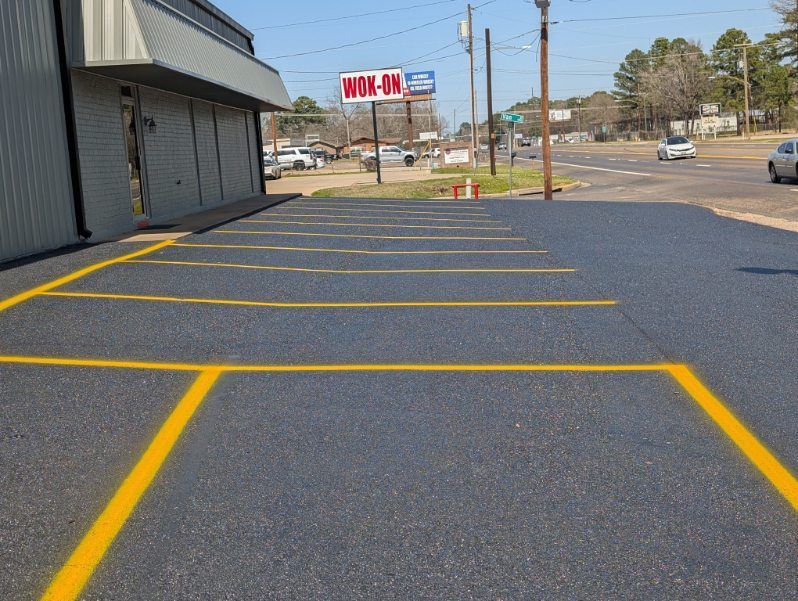 A Close Up of a Road With Yellow and Black Stripes on It