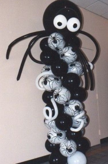 black & white balloon column with spider eyes