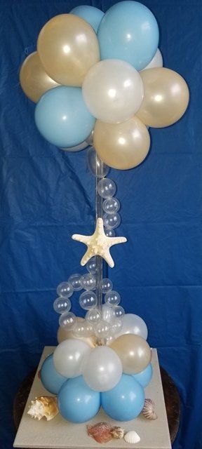 table centerpiece with pale blue and pearl white balloons