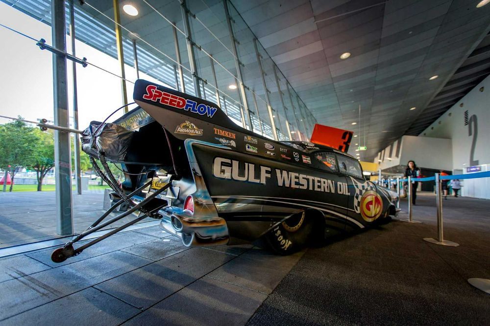 A Gulf Western Racing Car Is Parked in A Building — Wades Distributors In Cairns, QLD