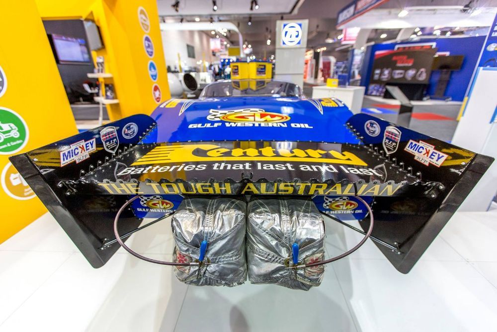 A Blue Race Car Is on Display at A Car Show — Wades Distributors In Darwin, NT