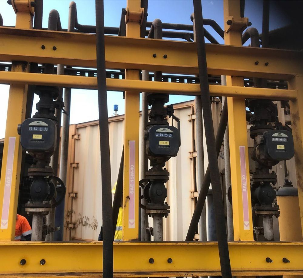 A Row of Yellow Pipes with One that Says U.S.A. on It — Wades Distributors In Mt Isa, QLD