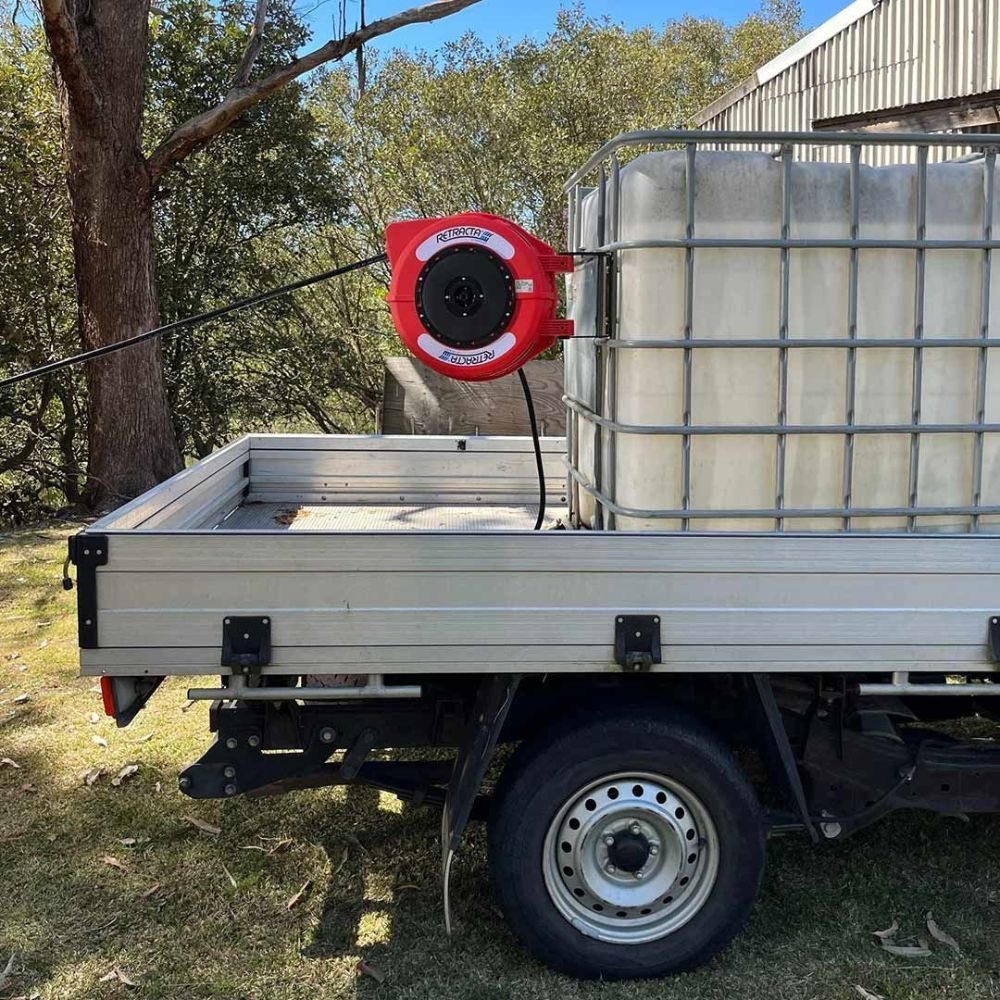 A Truck with A Hose Reel Attached to The Back of It — Wades Distributors In Mt Isa, QLD