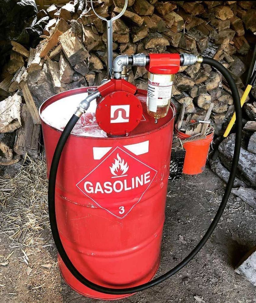 A Red Gasoline Barrel with A Pump Attached to It — Wades Distributors In Garbutt, QLD
