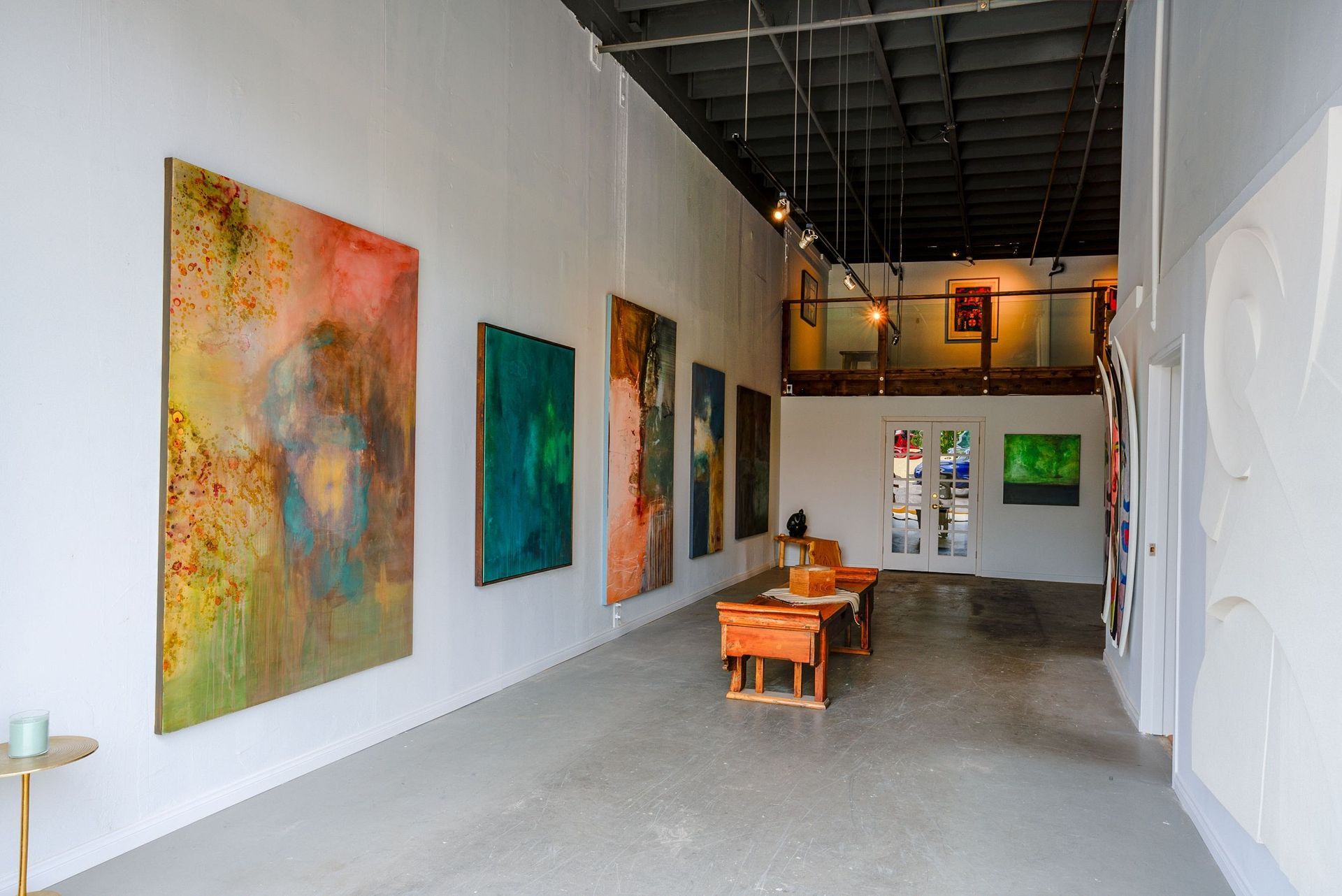 Anchor Art team expertly setting up an art exhibit in San Diego's premier gallery space.