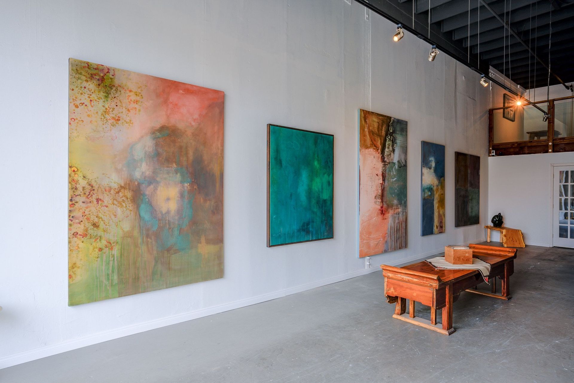 Anchor Art team expertly setting up an art exhibit in San Diego's premier gallery space