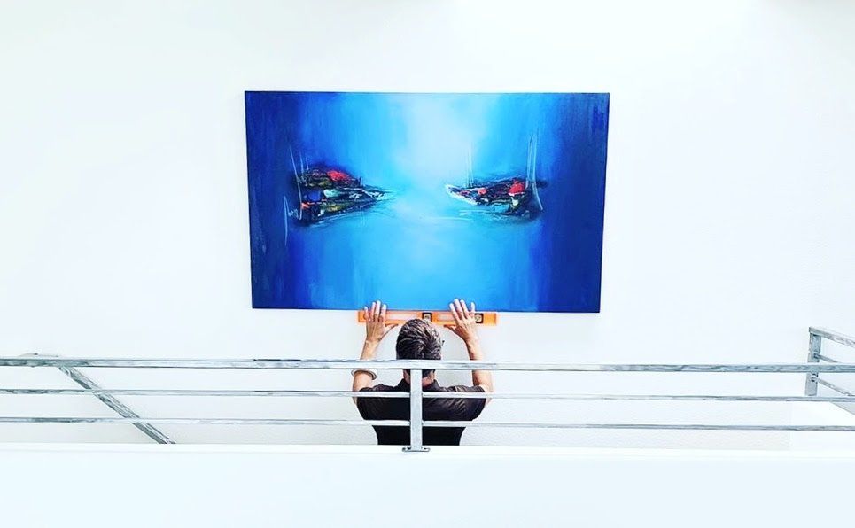 Art installation service in progress by skilled technicians in San Diego