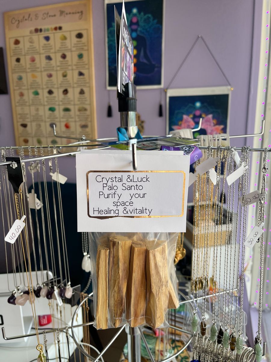 Display of Palo Santo sticks with a sign that reads 