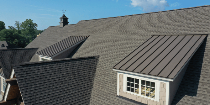 An aerial view of a house with a roof and a window.