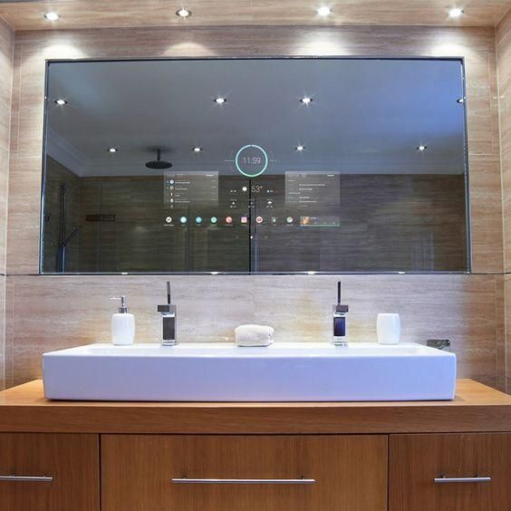 A bathroom with two sinks and a large mirror