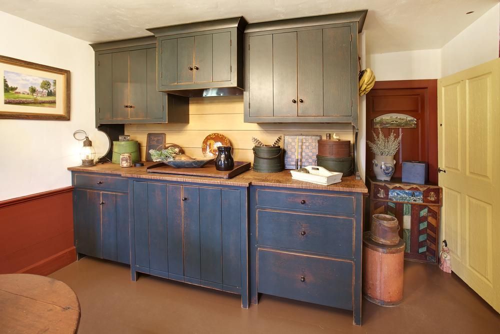 Farmhouse custom reclaimed wood kitchen cabinets painted blue.